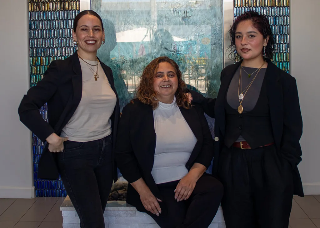 Queens Hair Studio team: Lorena Calvillo and expert stylists if Lorena is clearly the one in the middle and the others are stylists, but the simpler one is often sufficient